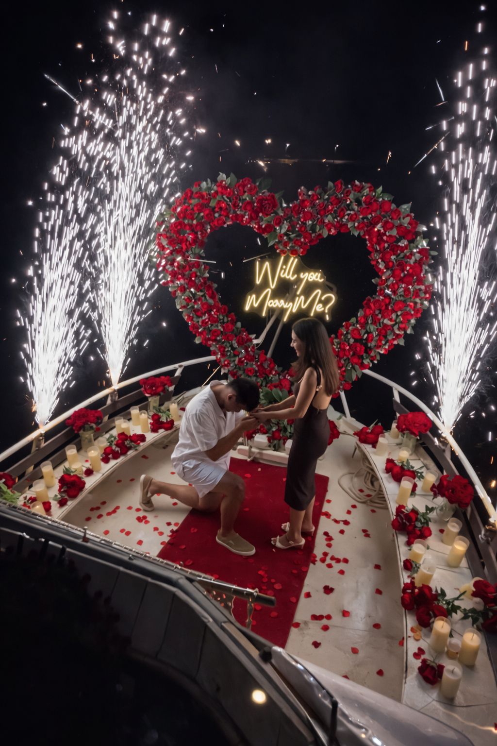 Man proposing on one knee with fireworks, rose heart arch, and Will You Marry Me neon sign aboard a luxury yacht in Lebanon