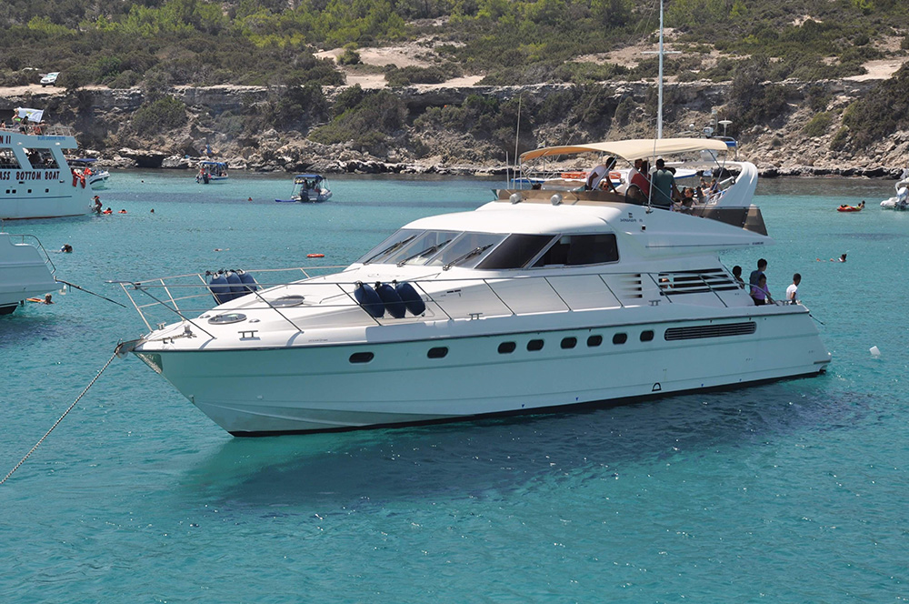 Luxury yacht anchored in turquoise Cyprus bay